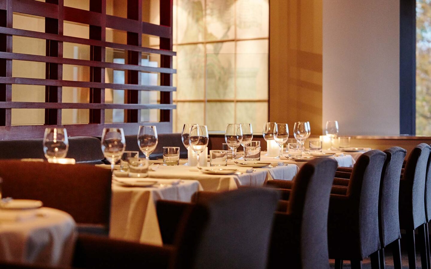 dining table in a restaurant set with wine glasses